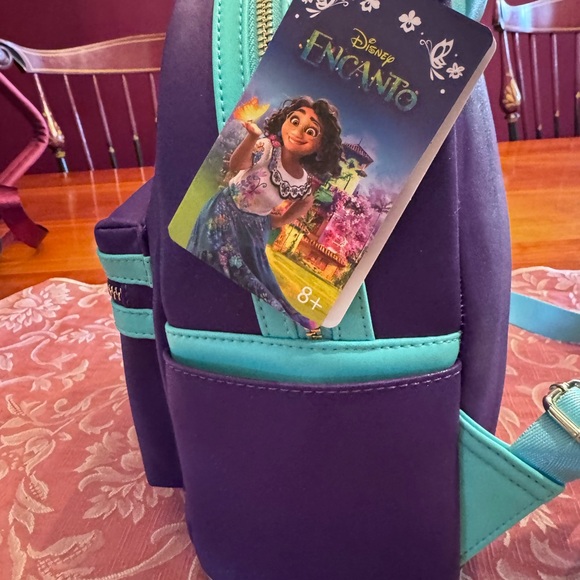 Loungefly Disney Mirabel Encanto Backpack! Perfect for Communicore opening! BNWT - Picture 2 of 5